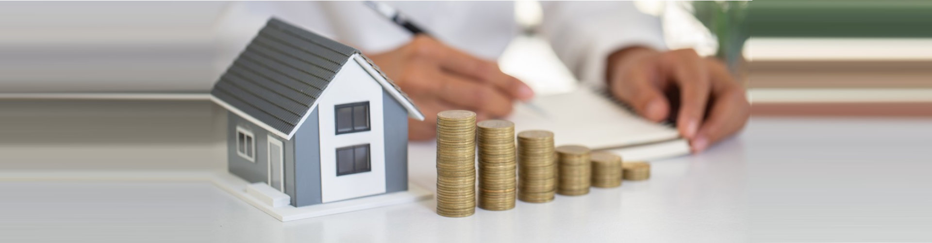 miniature house and coins